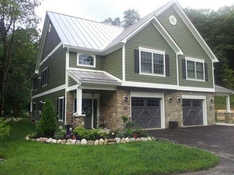 green vinyl house with a green metal roof|green vinyl exterior home.